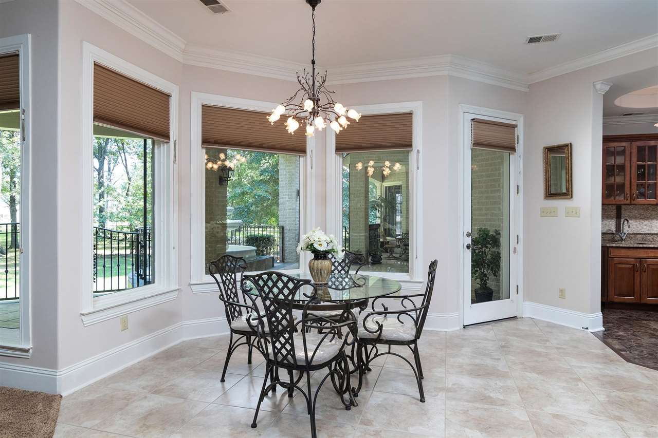 9496 Mayfield Road South Collierville, TN 38017 - Photo 16 of 25 a view of a dining room with furniture window and outside view