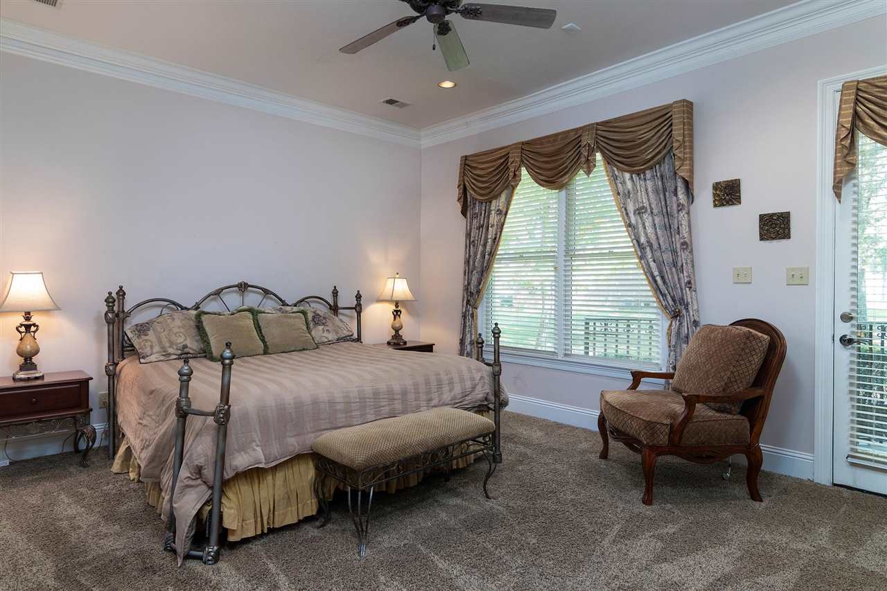9496 Mayfield Road South Collierville, TN 38017 - Photo 19 of 25 a spacious bedroom with a bed and a couch