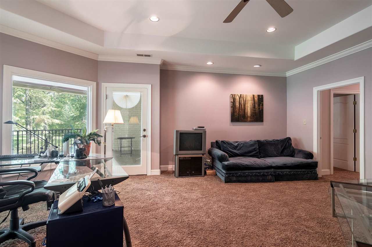 9496 Mayfield Road South Collierville, TN 38017 - Photo 21 of 25 a living room with furniture and a flat screen tv