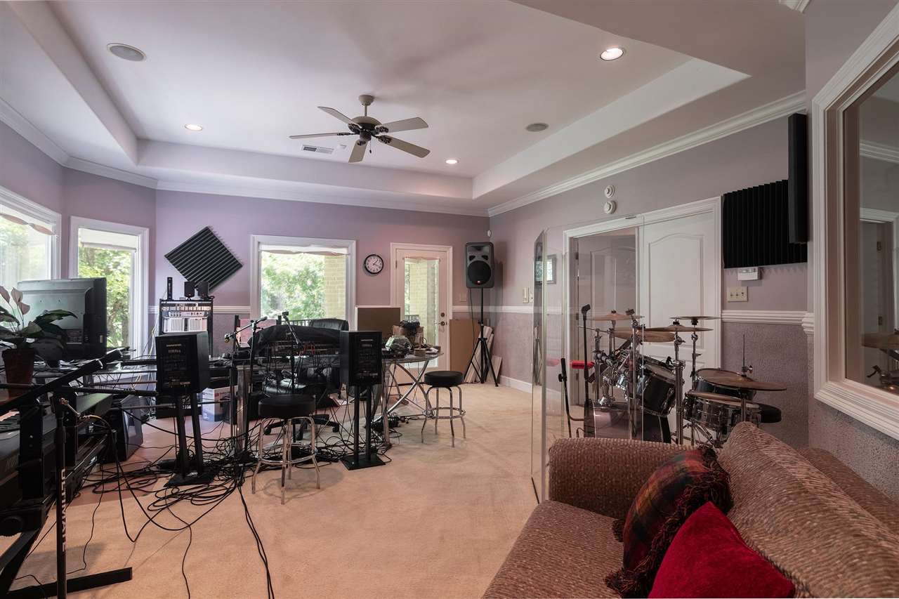 9496 Mayfield Road South Collierville, TN 38017 - Photo 22 of 25 a living room with lots of furniture and a flat screen tv