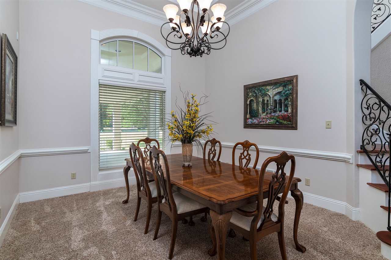 9496 Mayfield Road South Collierville, TN 38017 - Photo 5 of 25 a view of a dining room with furniture a chandelier and wooden floor