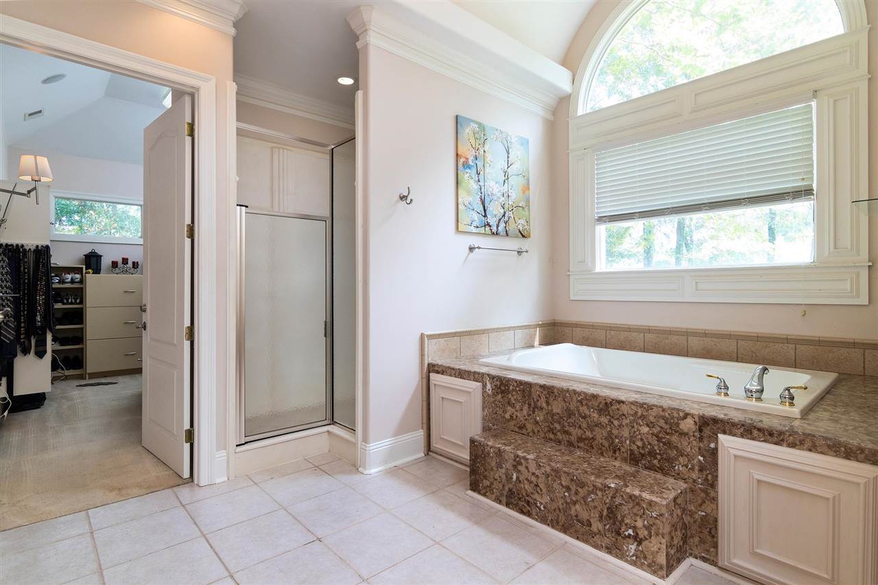 9496 Mayfield Road South Collierville, TN 38017 - Photo 10 of 25 a bathroom with a tub sink and mirror