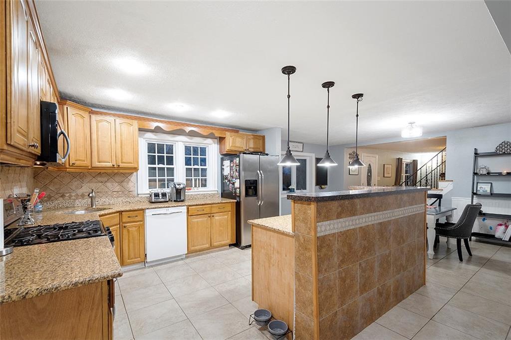 330 Johnston Road Pittsburgh, PA 15241 - Photo 4 of 25 Kitchen with granite countertops, tons of cabinets, and center island!