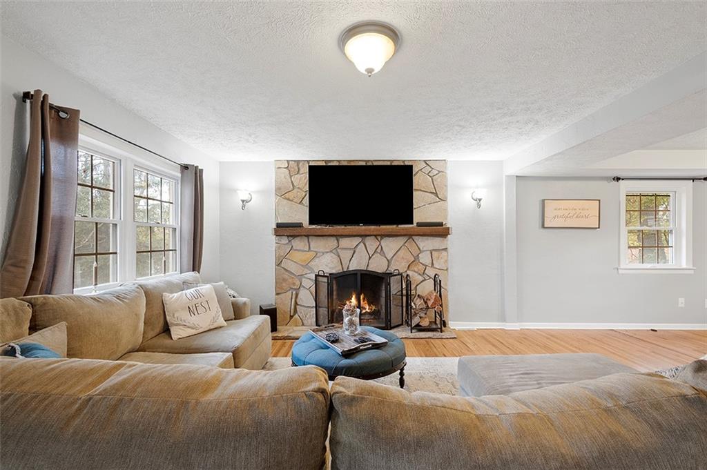 330 Johnston Road Pittsburgh, PA 15241 - Photo 8 of 25 Family room with a beautiful wood burning stone fireplace to cuddle up in front of on these chilly fall evenings!