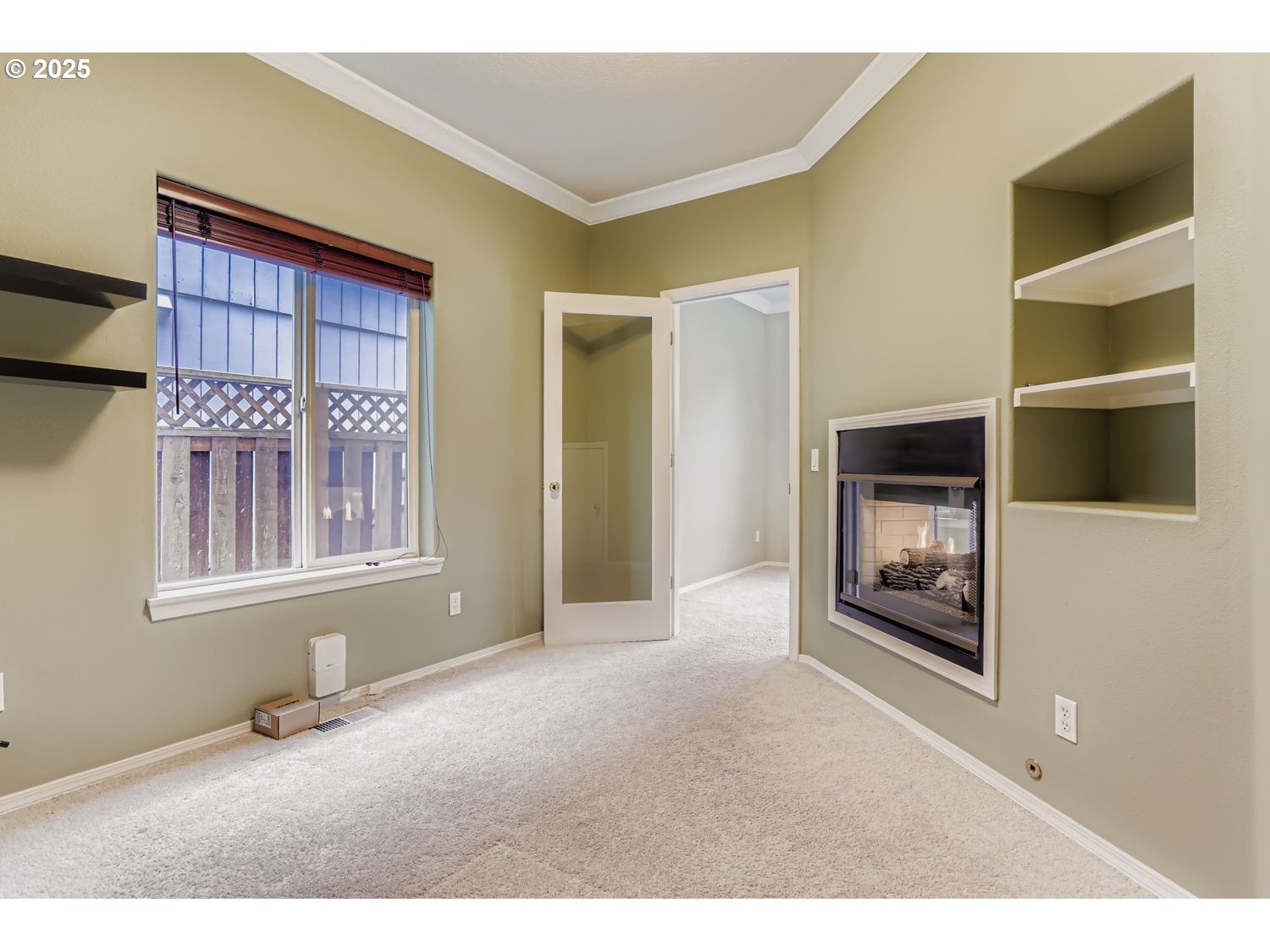 12697 Southwest Canvasback Way Beaverton, OR 97007 - Photo 11 of 41 a living room with a fireplace and a flat screen tv