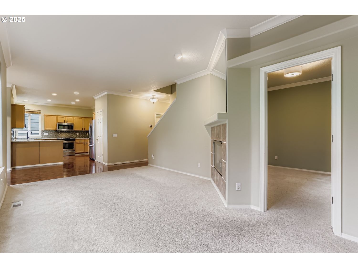 12697 Southwest Canvasback Way Beaverton, OR 97007 - Photo 18 of 41 a view of empty room with kitchen view
