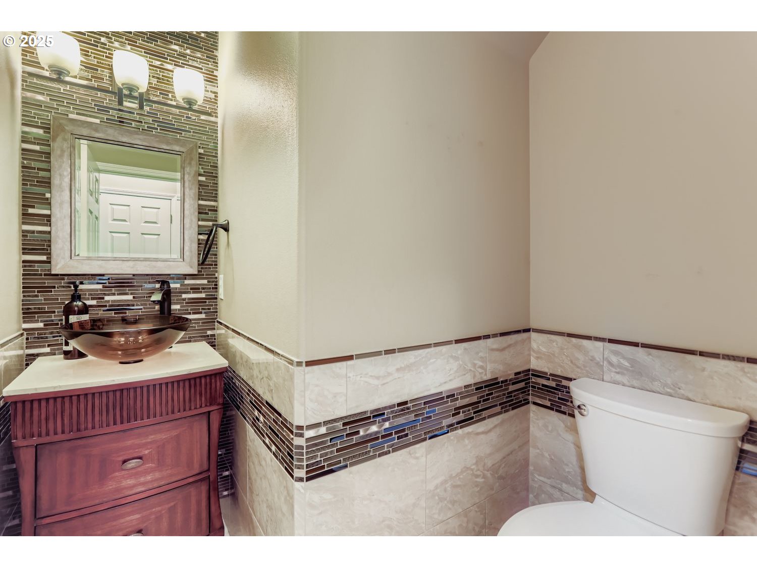 12697 Southwest Canvasback Way Beaverton, OR 97007 - Photo 19 of 41 a bathroom with a sink and a mirror