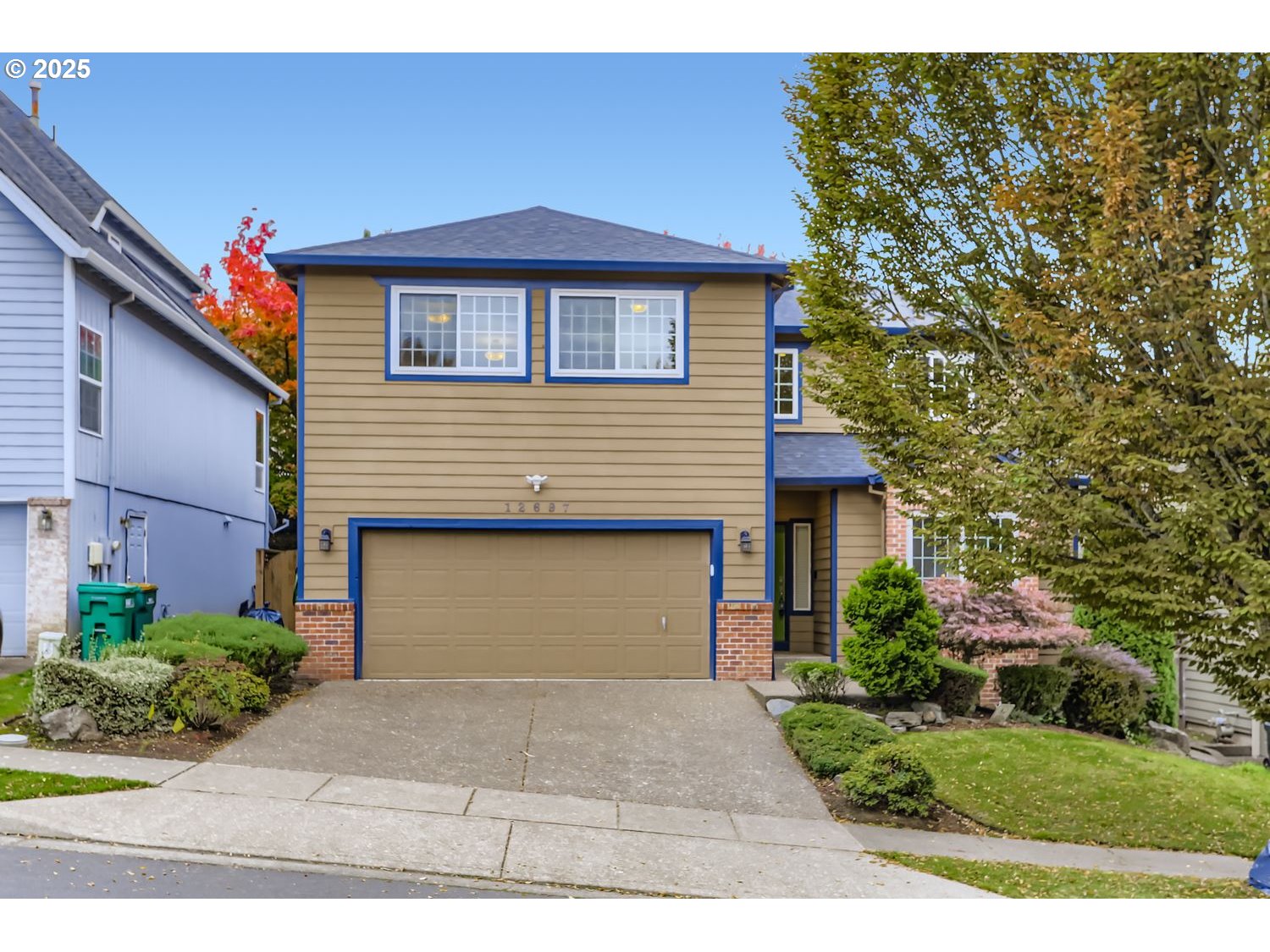 12697 Southwest Canvasback Way Beaverton, OR 97007 - Photo 2 of 41 a front view of a house with a garden