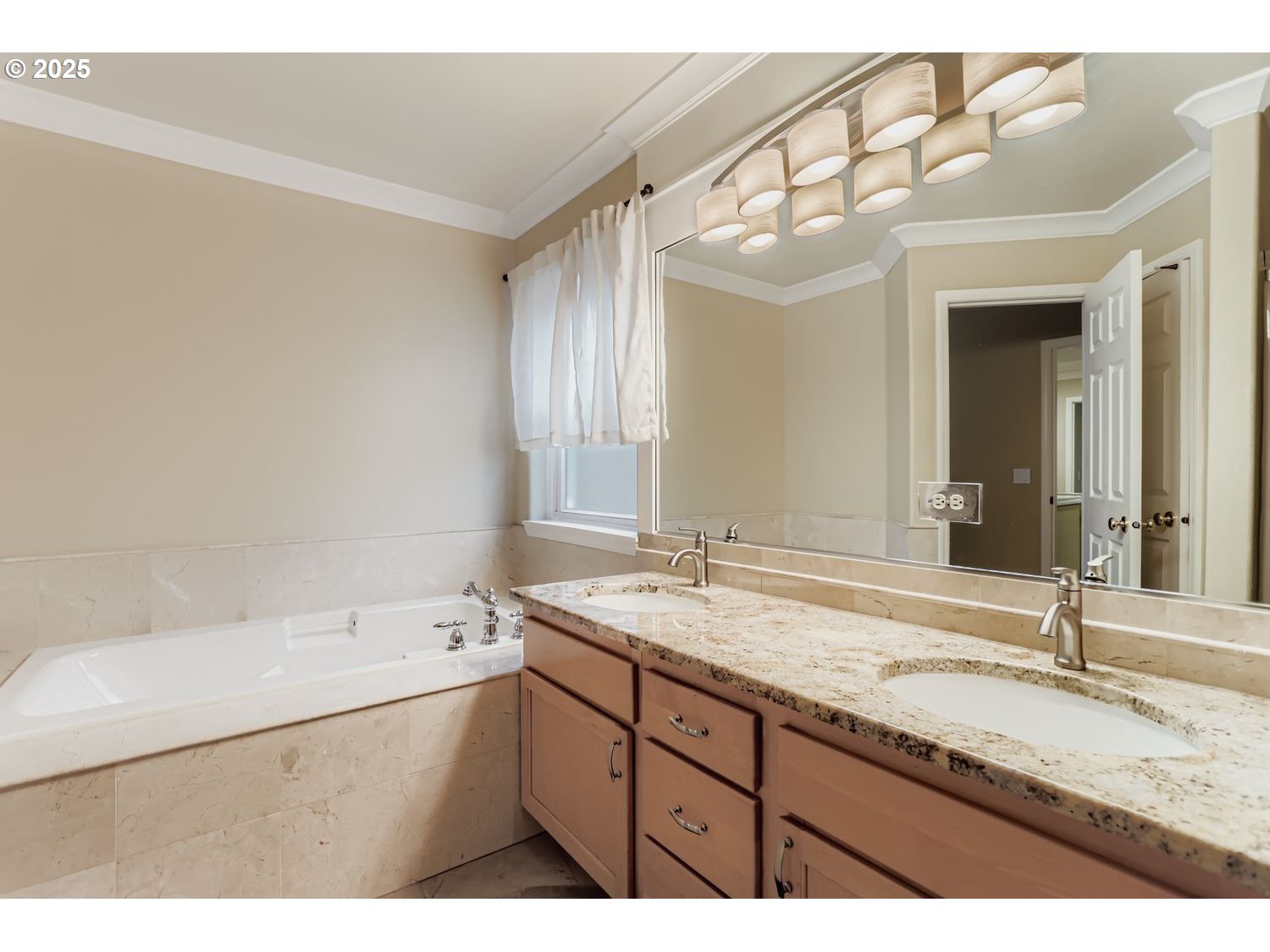 12697 Southwest Canvasback Way Beaverton, OR 97007 - Photo 23 of 41 a bathroom with a granite countertop sink mirror and bathtub