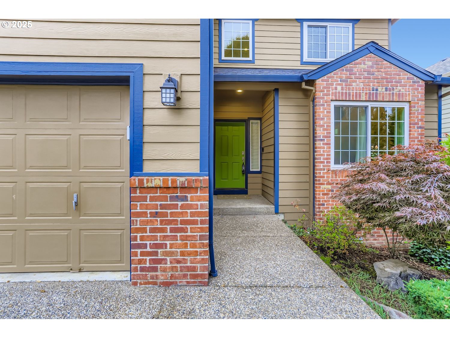 12697 Southwest Canvasback Way Beaverton, OR 97007 - Photo 4 of 41 a front view of a house with a yard