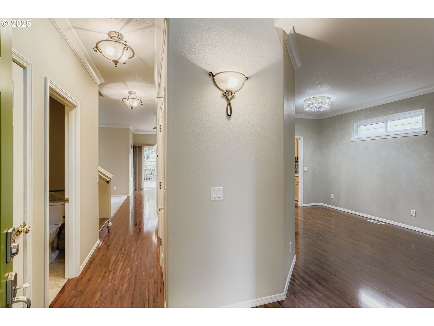 12697 Southwest Canvasback Way Beaverton, OR 97007 - Photo 5 of 41 a view of a hallway with wooden floor