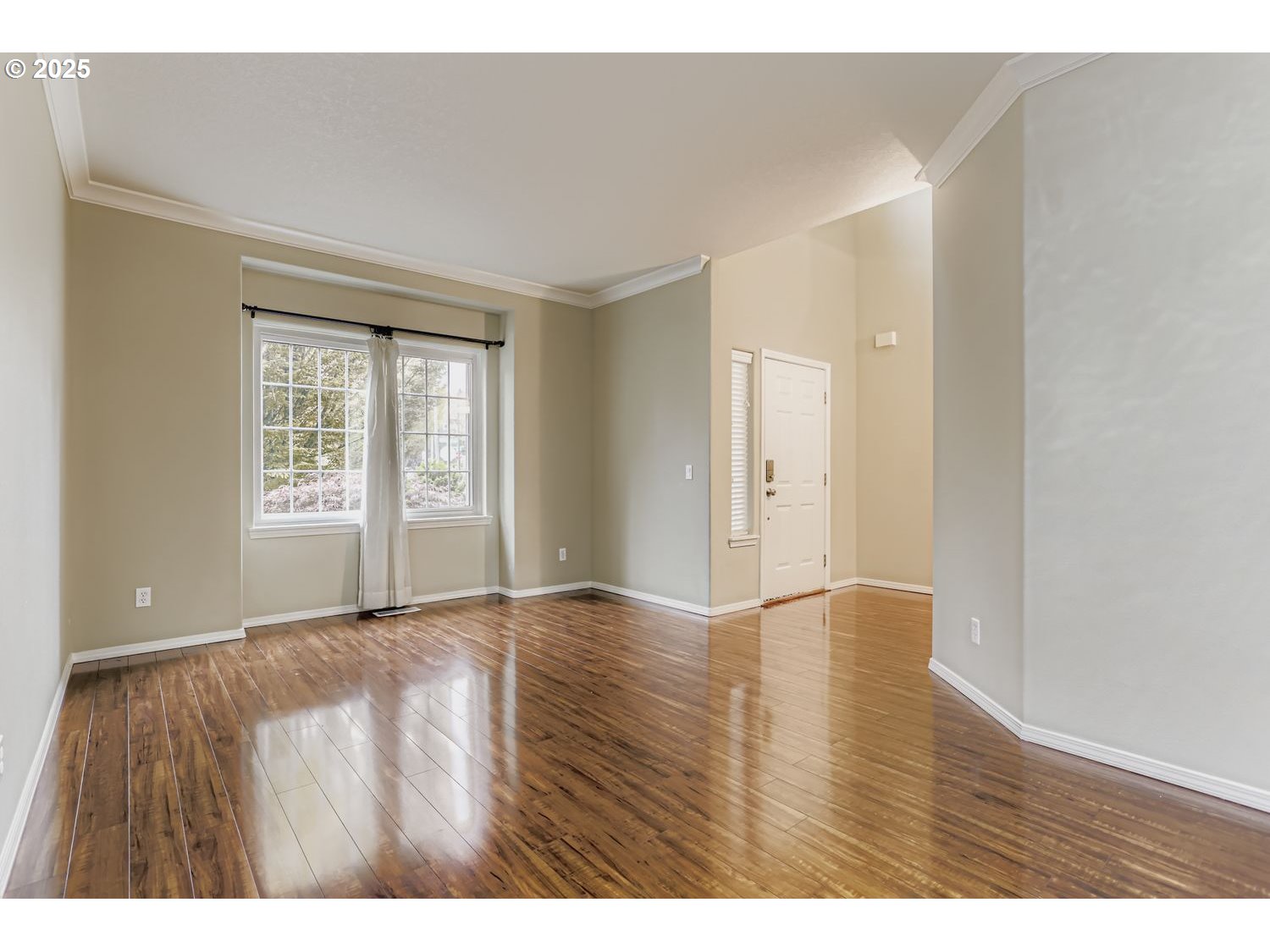 12697 Southwest Canvasback Way Beaverton, OR 97007 - Photo 7 of 41 a view of an empty room with wooden floor and a window