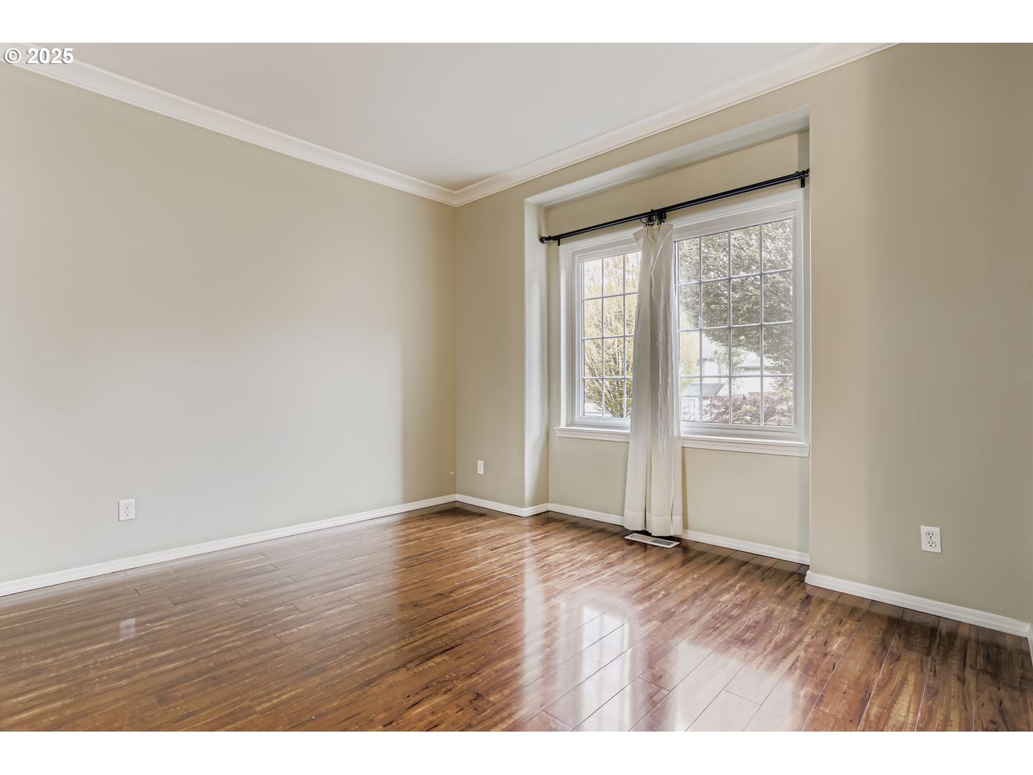 12697 Southwest Canvasback Way Beaverton, OR 97007 - Photo 8 of 41 a view of an empty room with wooden floor and a window