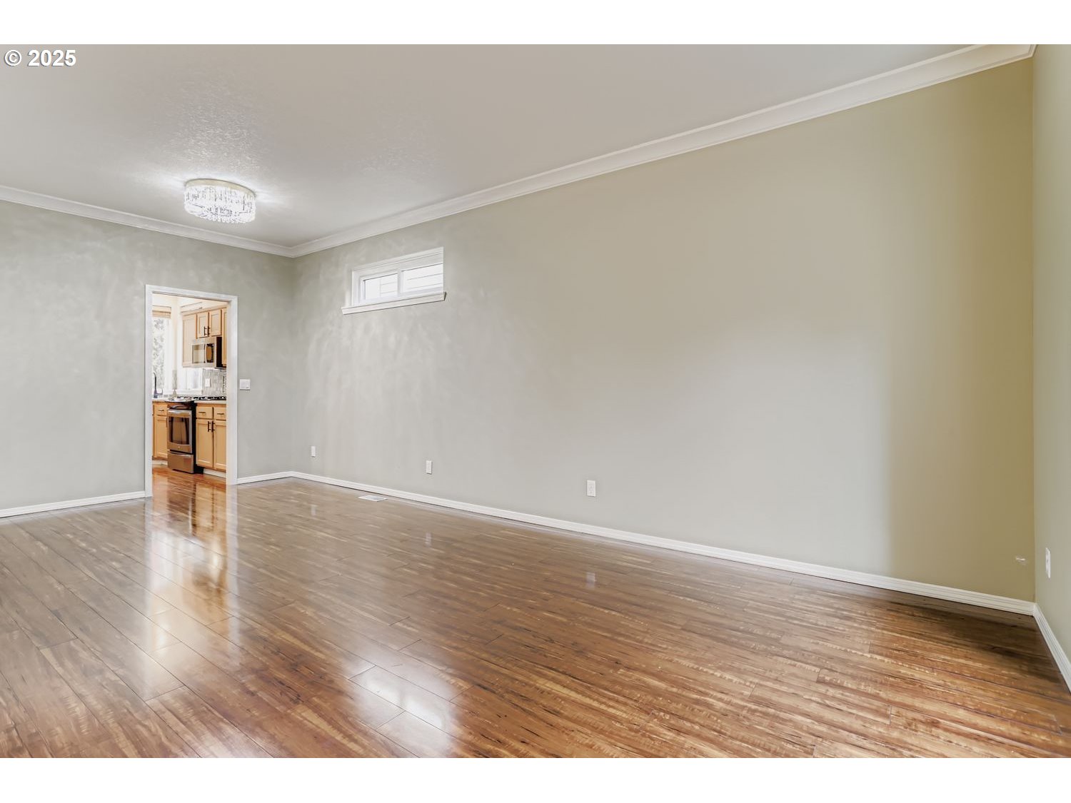 12697 Southwest Canvasback Way Beaverton, OR 97007 - Photo 9 of 41 a view of an empty room with wooden floor and a window