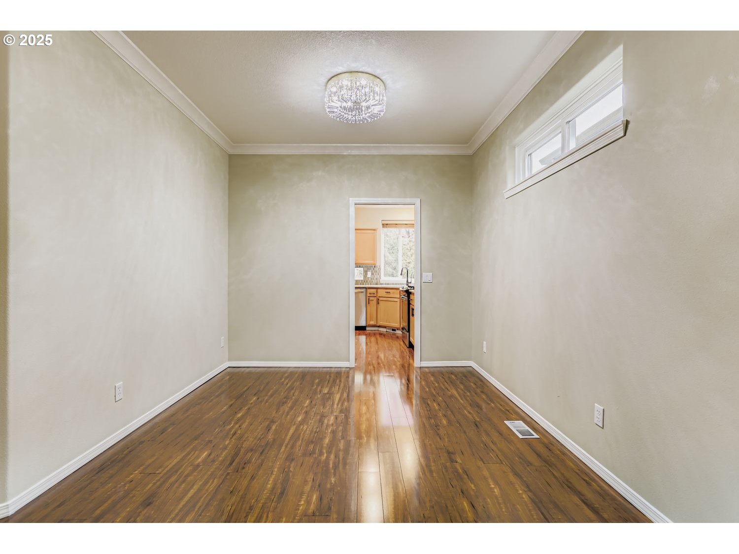 12697 Southwest Canvasback Way Beaverton, OR 97007 - Photo 10 of 41 a view of an empty room with wooden floor