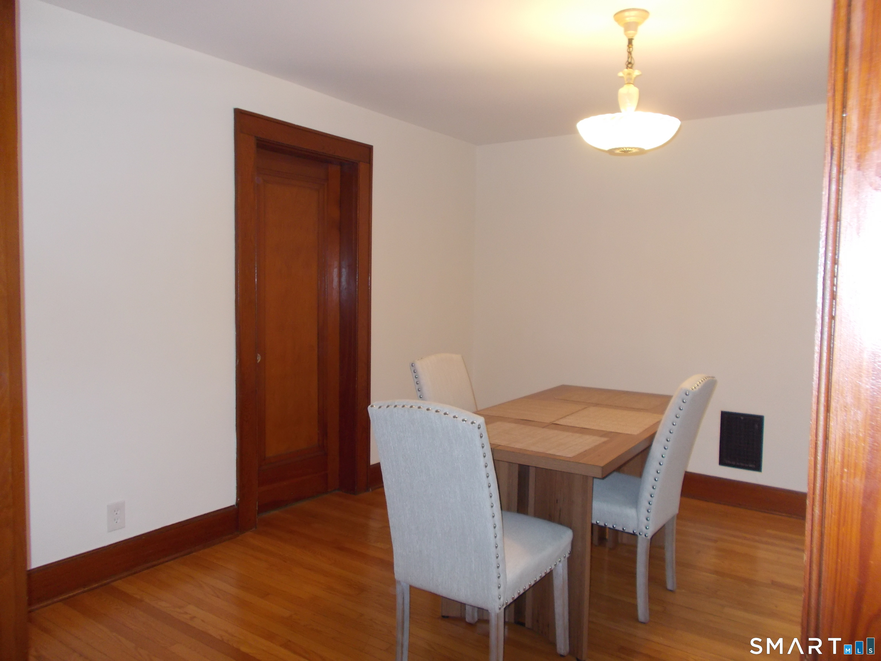 42 Holbrook Place, Unit 2 Ansonia, CT 06401 - Photo 4 of 12 a view of a dining room with furniture and wooden floor