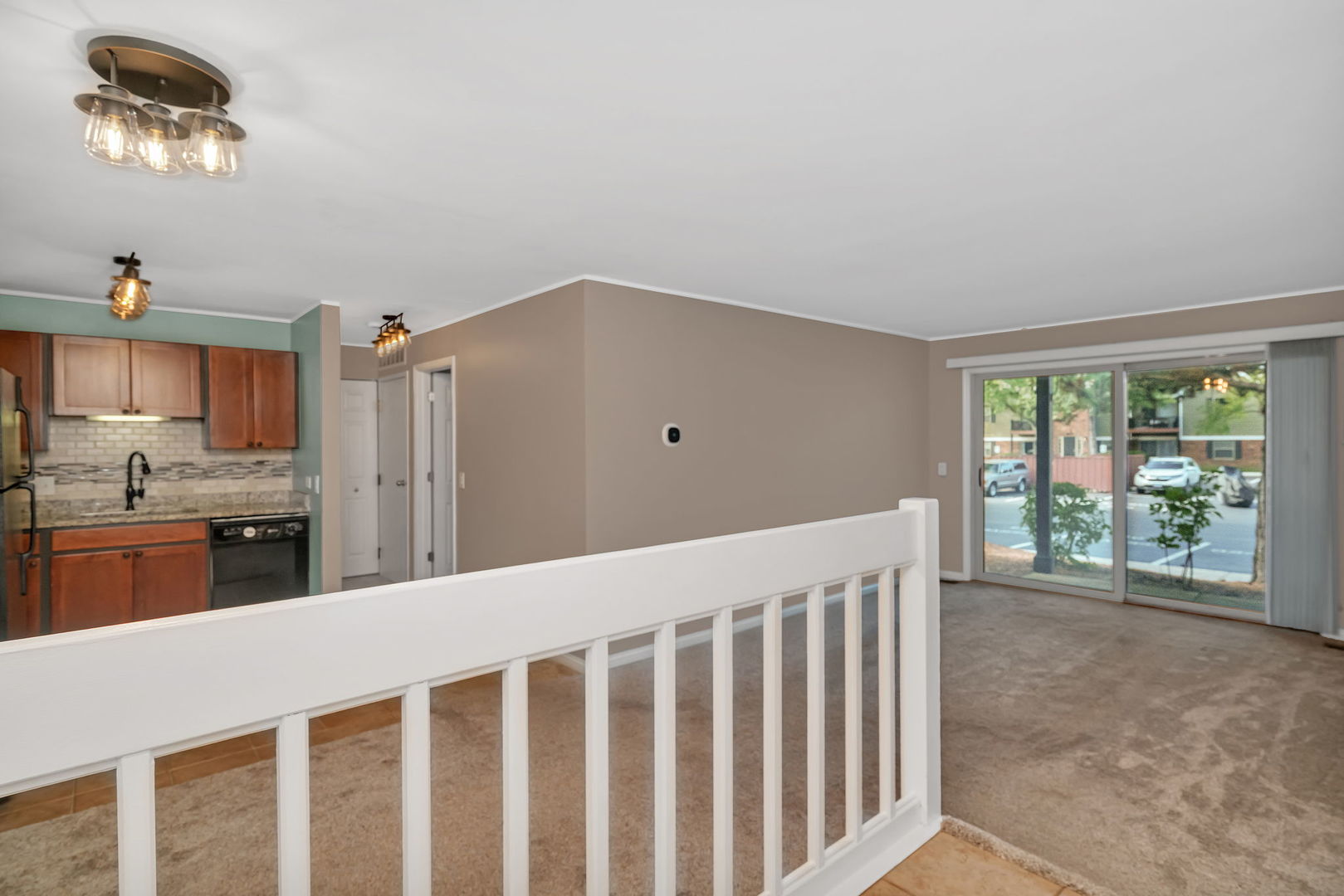 1332 McDowell Road, Unit 104 Naperville, IL 60563 - Photo 4 of 19 a view of a kitchen with wooden floor and a window