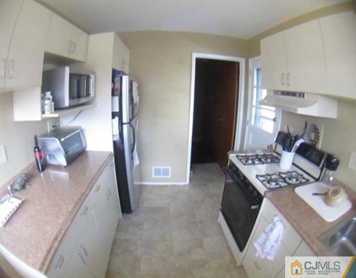 81 Princeton Road Old Bridge, NJ 08859 - Photo 11 of 15 a view of kitchen and living room
