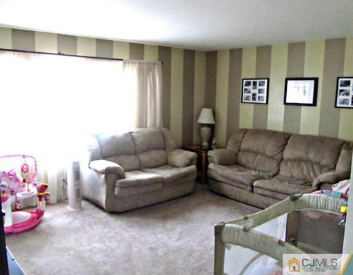 81 Princeton Road Old Bridge, NJ 08859 - Photo 12 of 15 a living room with furniture and a window