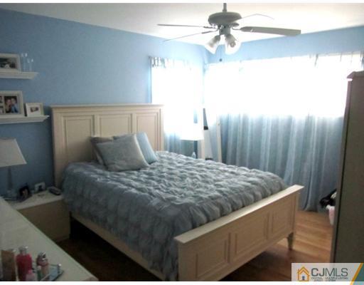 81 Princeton Road Old Bridge, NJ 08859 - Photo 13 of 15 a bed sitting in a bedroom next to a window