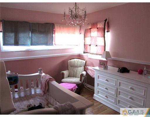 81 Princeton Road Old Bridge, NJ 08859 - Photo 6 of 15 a living room with furniture a chandelier and a window