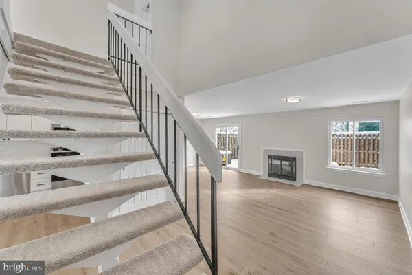 a view of an entryway with wooden floor