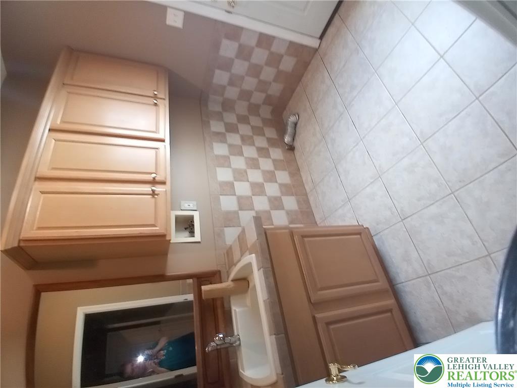 1560 Deer Path Road Easton, PA 18040 - Photo 14 of 38 1st floor Laundry with sink & cabinets