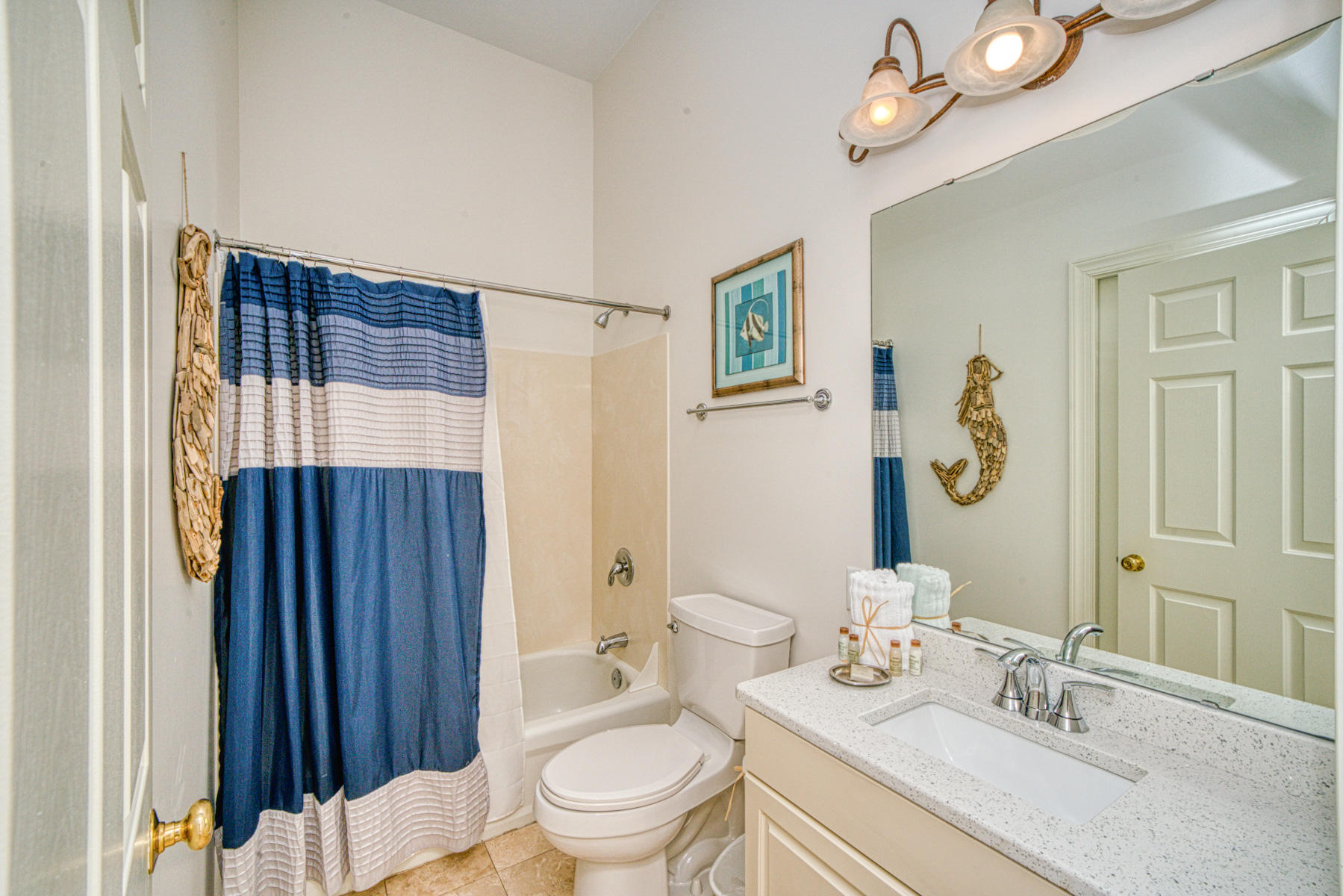 10343 East County Highway 30A, Unit 307 Seacrest, FL 32413 - Photo 13 of 34 a bathroom with a sink a toilet and shower curtain