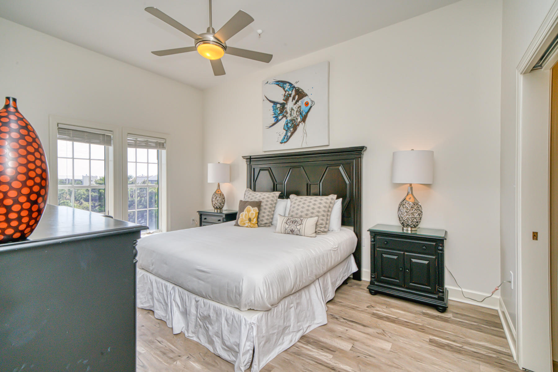 10343 East County Highway 30A, Unit 307 Seacrest, FL 32413 - Photo 17 of 34 a bedroom with a bed and a chandelier