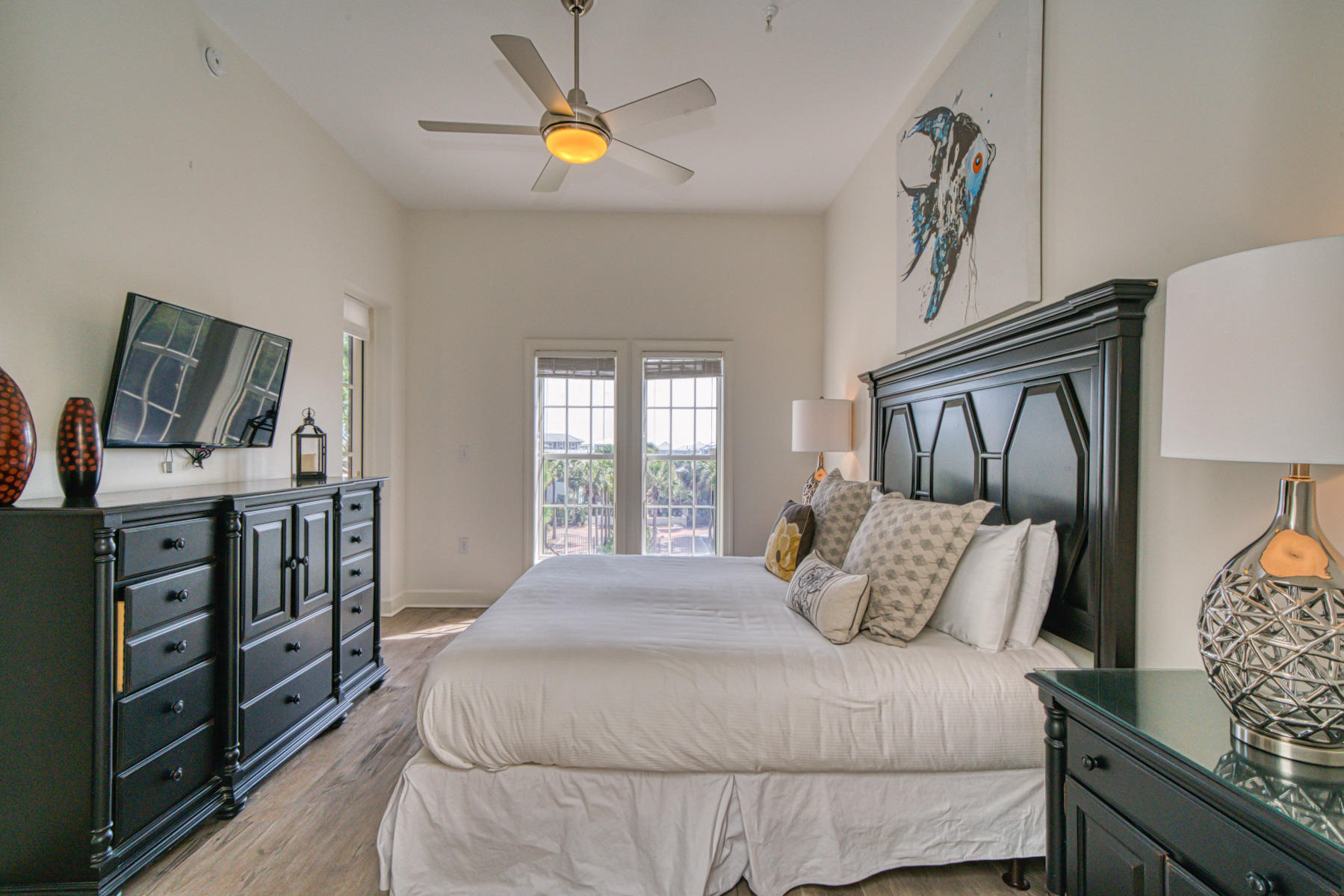 10343 East County Highway 30A, Unit 307 Seacrest, FL 32413 - Photo 18 of 34 a bedroom with a bed and a flat tv screen on a dresser