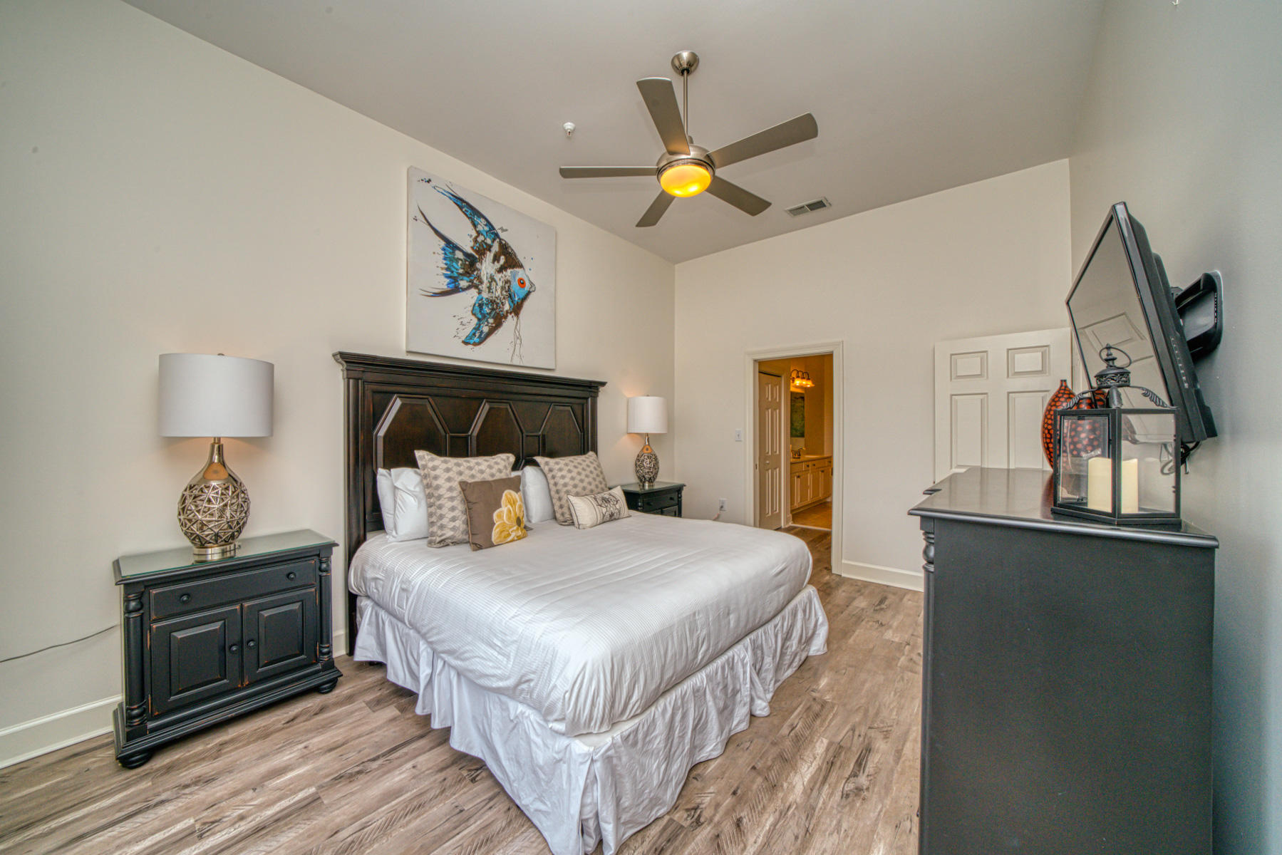 10343 East County Highway 30A, Unit 307 Seacrest, FL 32413 - Photo 19 of 34 a bedroom with a bed and wooden floor