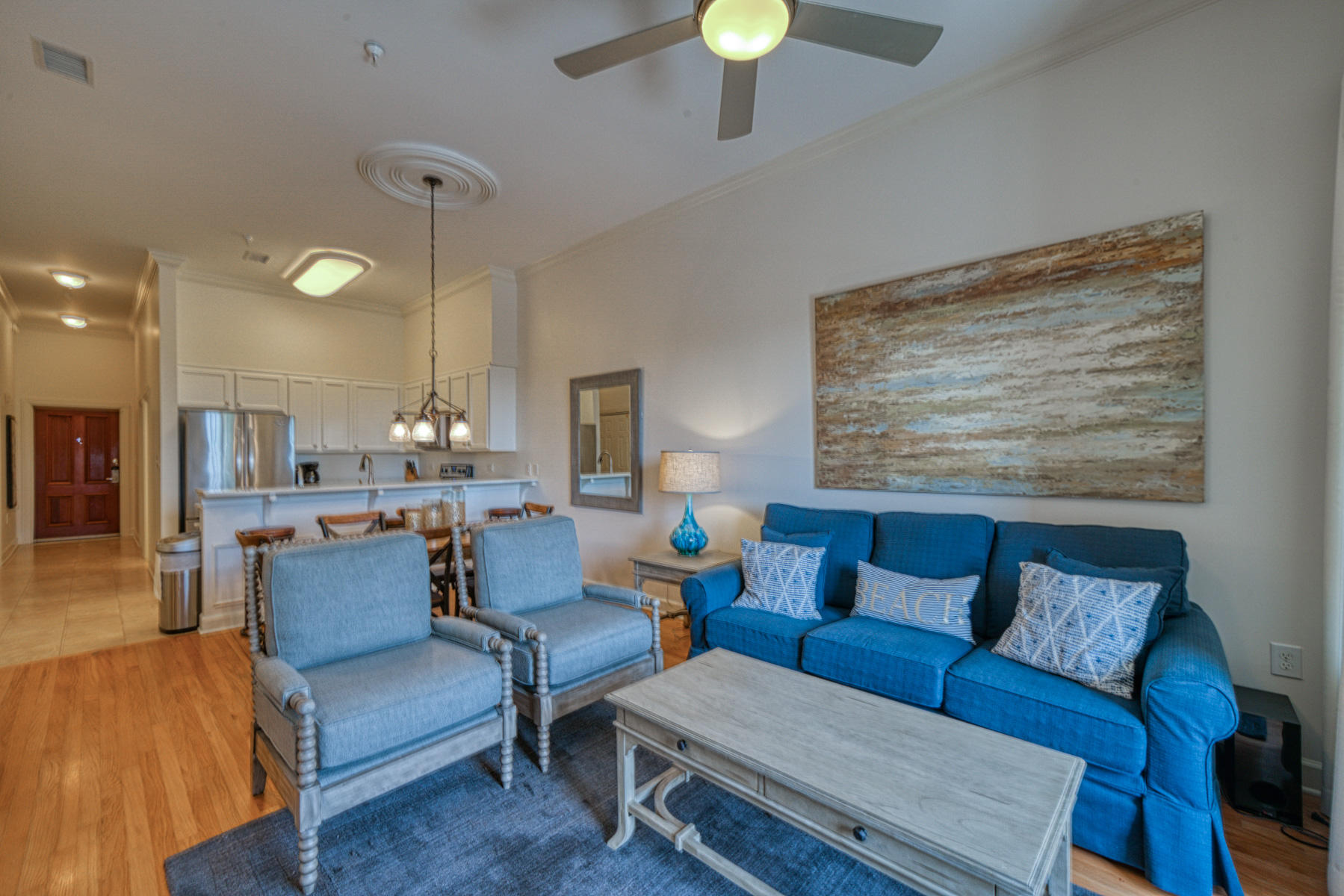10343 East County Highway 30A, Unit 307 Seacrest, FL 32413 - Photo 21 of 34 a living room with furniture and a lamp