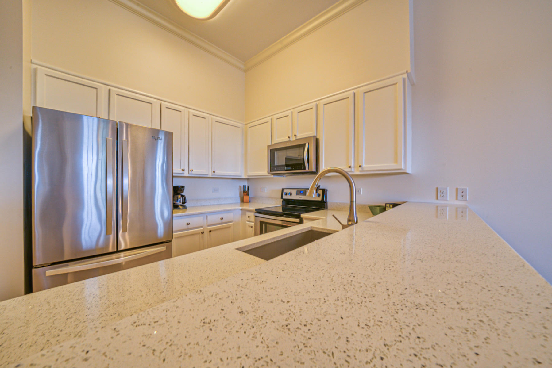 10343 East County Highway 30A, Unit 307 Seacrest, FL 32413 - Photo 23 of 34 a kitchen with stainless steel appliances a refrigerator sink and microwave