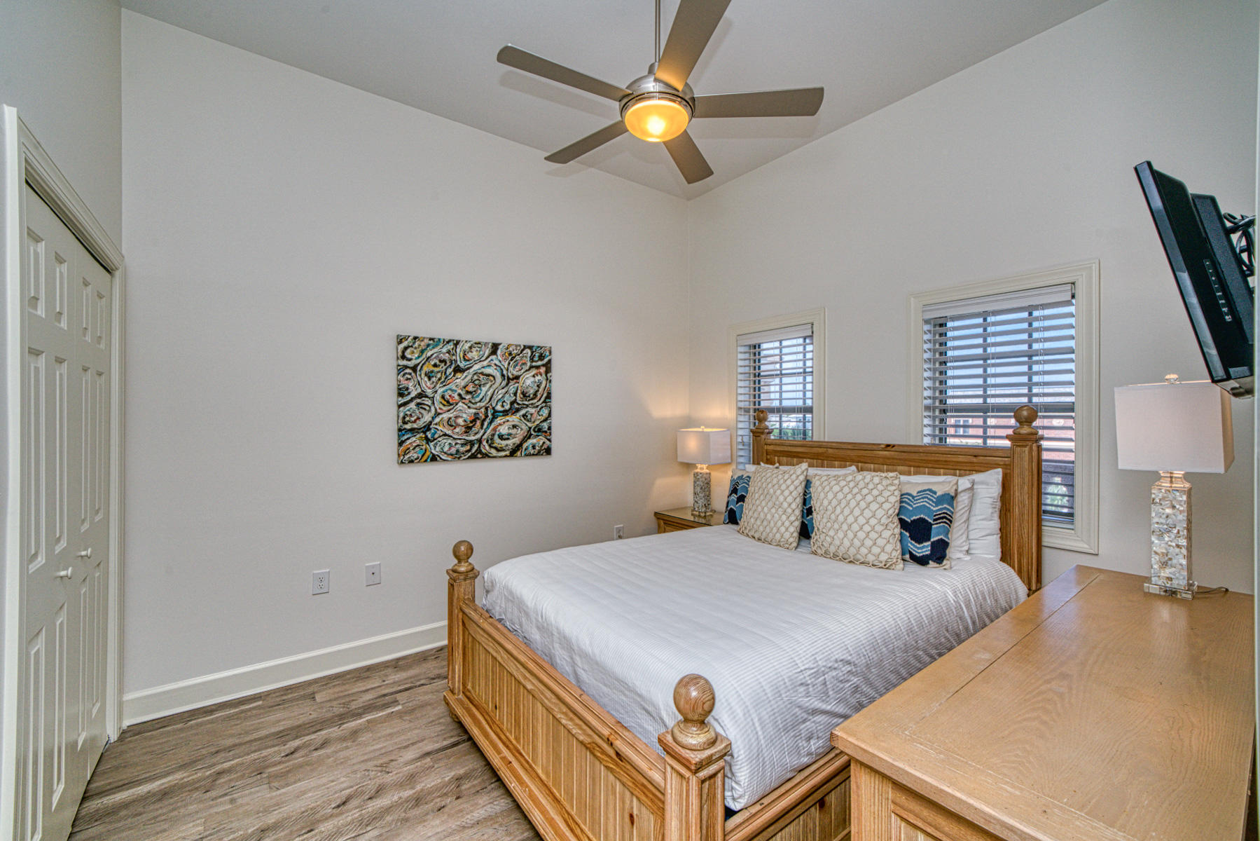 10343 East County Highway 30A, Unit 307 Seacrest, FL 32413 - Photo 28 of 34 a bedroom with a bed and a chandelier
