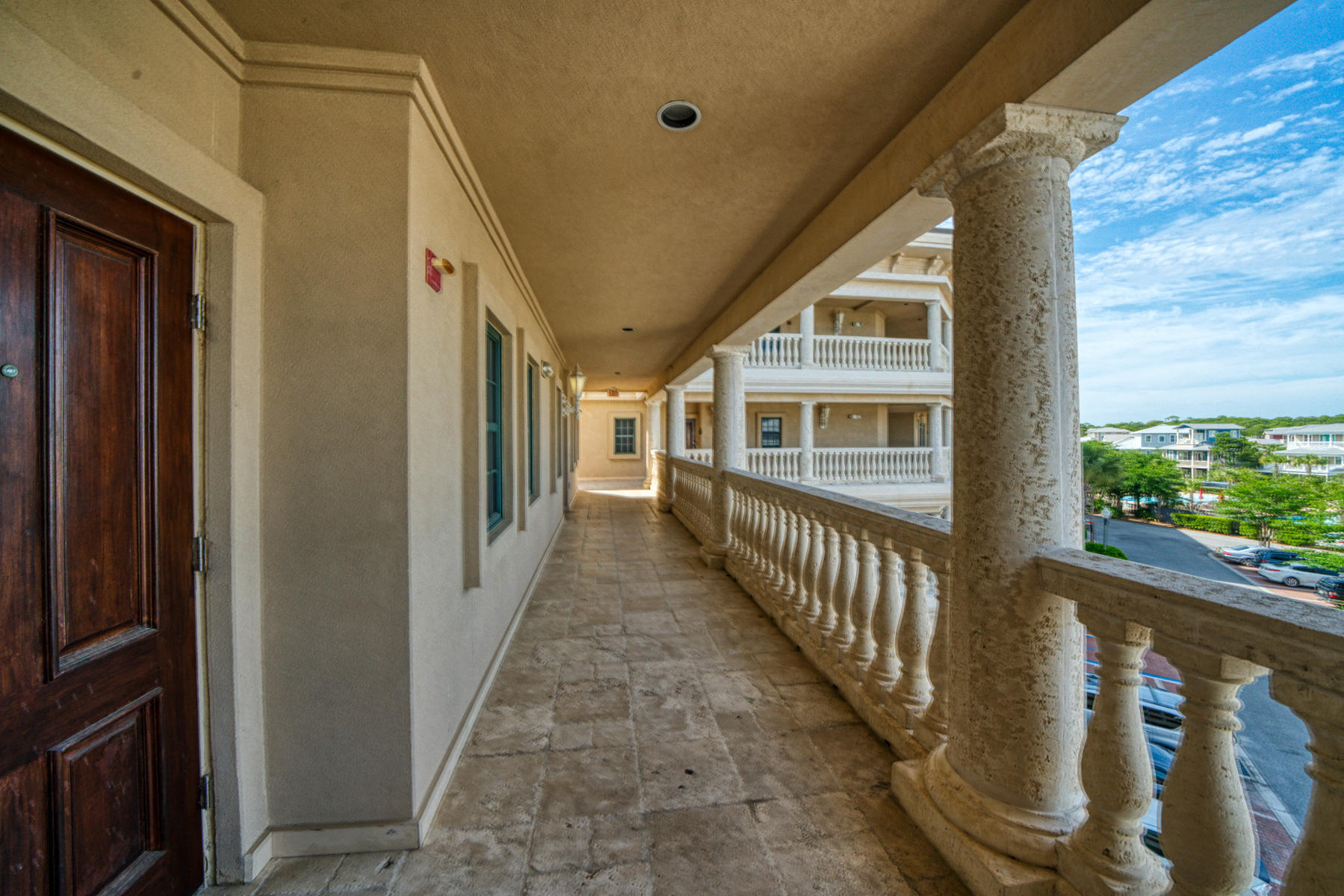 10343 East County Highway 30A, Unit 307 Seacrest, FL 32413 - Photo 30 of 34 a view of a porch with wooden floor and fence