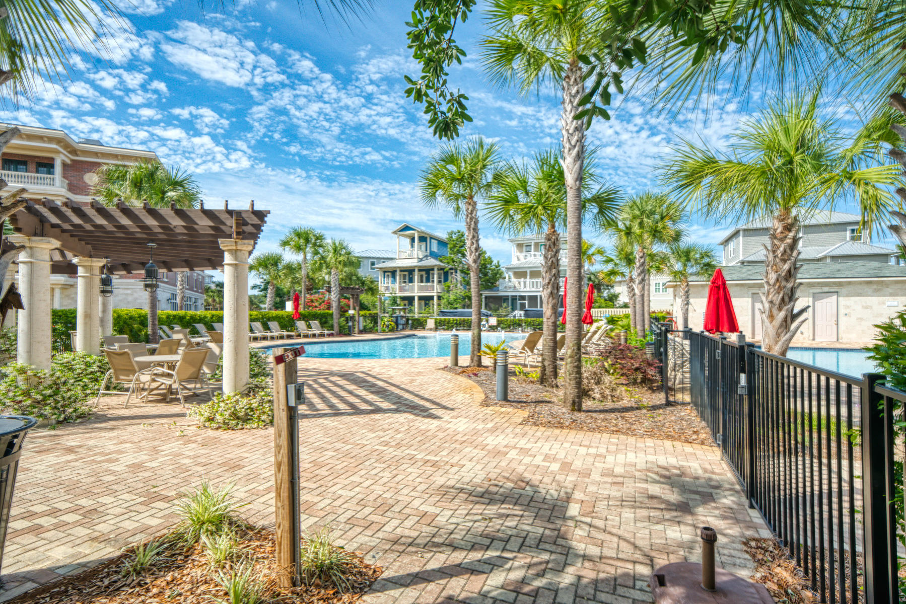 10343 East County Highway 30A, Unit 307 Seacrest, FL 32413 - Photo 33 of 34 a view of a backyard with a large tree and wooden fence