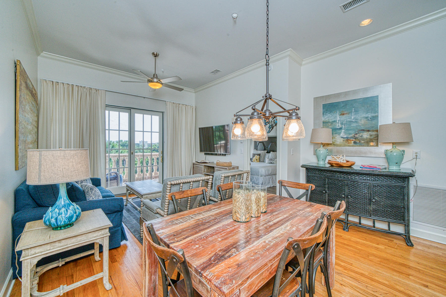 10343 East County Highway 30A, Unit 307 Seacrest, FL 32413 - Photo 5 of 34 a view of a dining room with furniture window and wooden floor