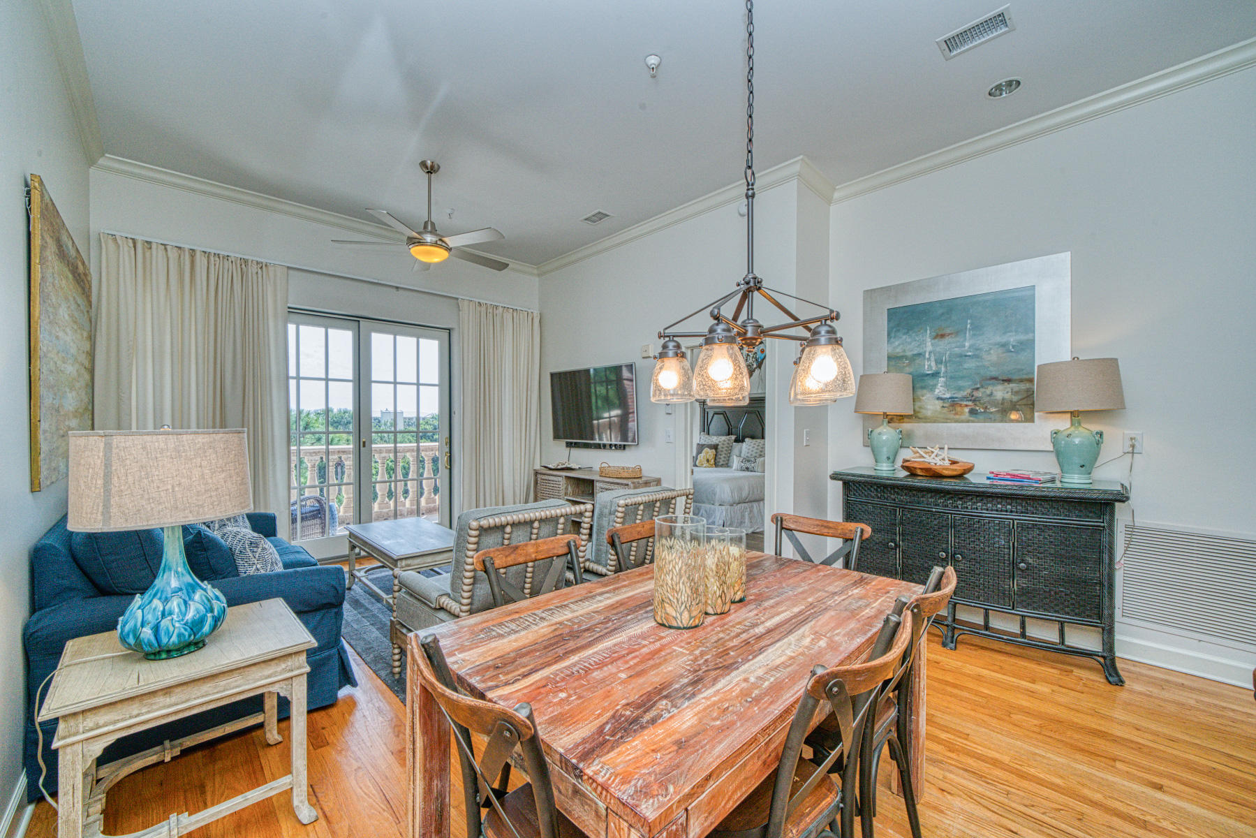 10343 East County Highway 30A, Unit 307 Seacrest, FL 32413 - Photo 6 of 34 a view of a dining room with furniture window and wooden floor