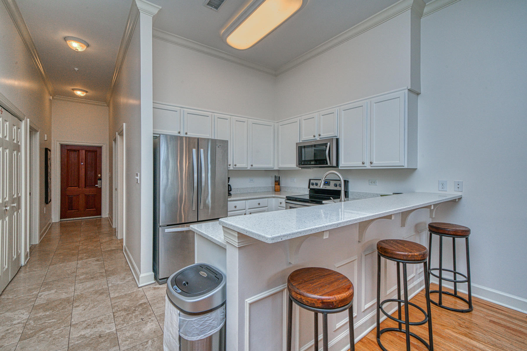 10343 East County Highway 30A, Unit 307 Seacrest, FL 32413 - Photo 9 of 34 a kitchen with stainless steel appliances granite countertop a sink a stove a refrigerator and cabinets