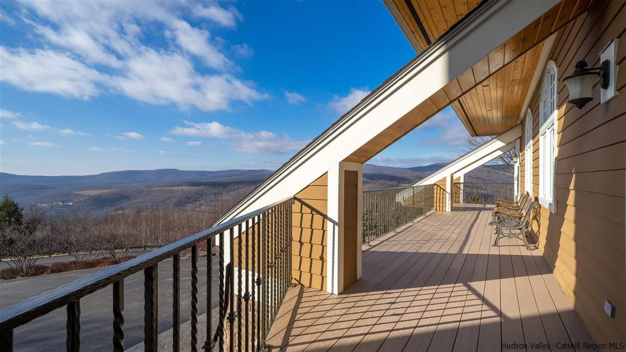 374 Kristins Ridge Road Margaretville, NY 12455 - Photo 16 of 33 a view of balcony with wooden floor and mountain view