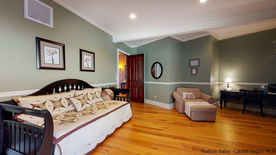 374 Kristins Ridge Road Margaretville, NY 12455 - Photo 25 of 33 a spacious bedroom with a bed and wooden floor