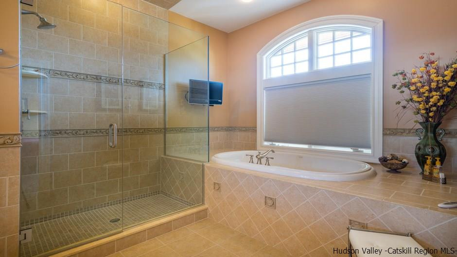 374 Kristins Ridge Road Margaretville, NY 12455 - Photo 26 of 33 a bathroom with a bathtub and a shower