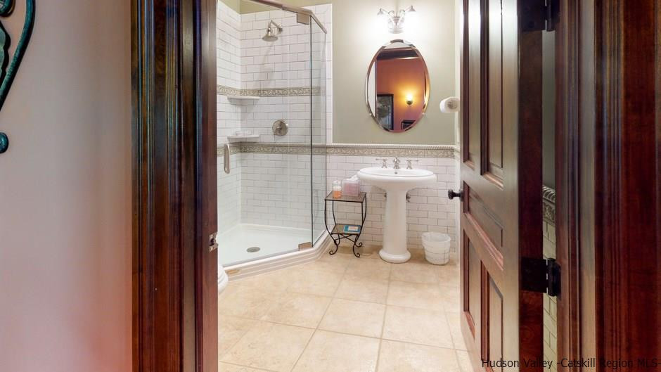 374 Kristins Ridge Road Margaretville, NY 12455 - Photo 28 of 33 a bathroom with a sink and a mirror