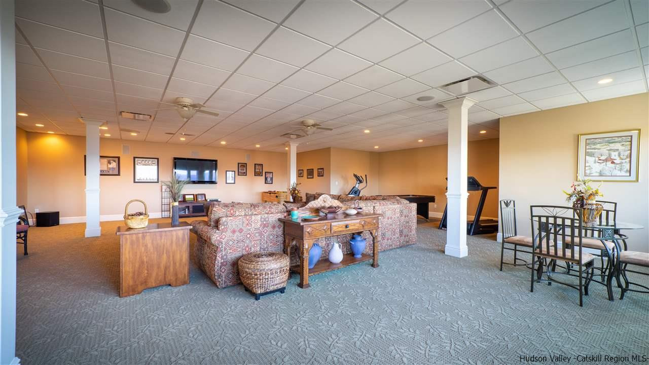 374 Kristins Ridge Road Margaretville, NY 12455 - Photo 31 of 33 a living room with furniture and a table