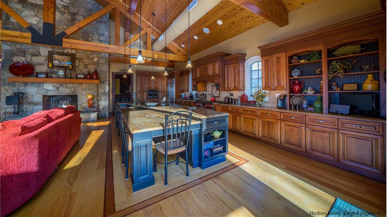 374 Kristins Ridge Road Margaretville, NY 12455 - Photo 7 of 33 a kitchen with stainless steel appliances granite countertop a stove a sink and a microwave