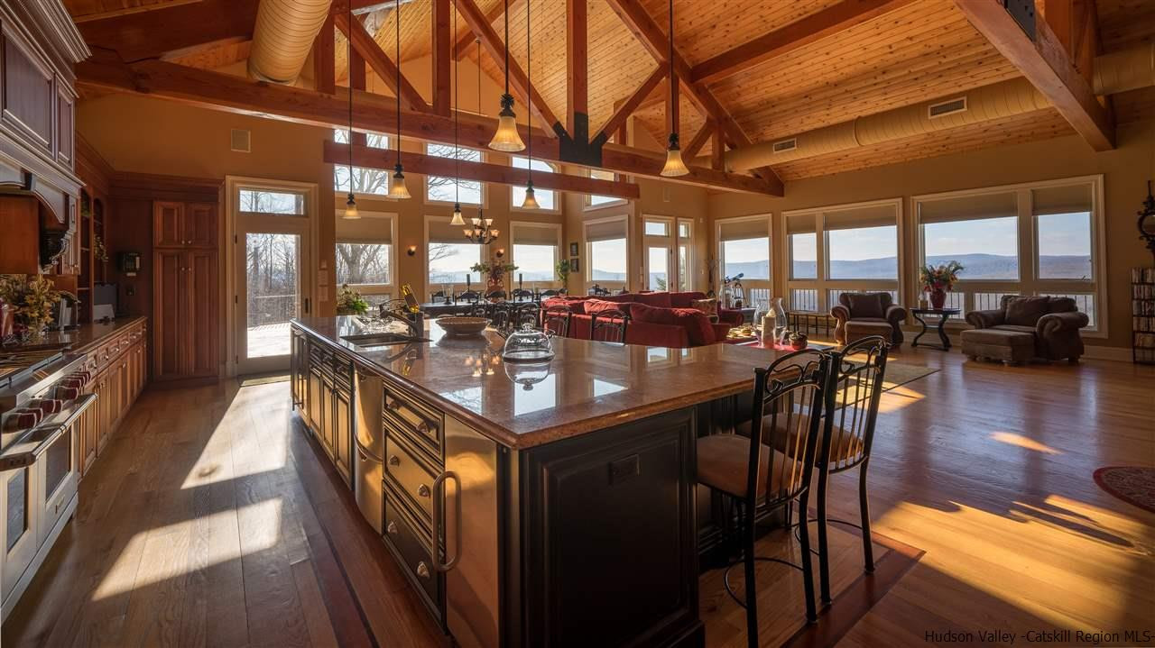 374 Kristins Ridge Road Margaretville, NY 12455 - Photo 10 of 33 a view of a dining room with furniture window and wooden floor