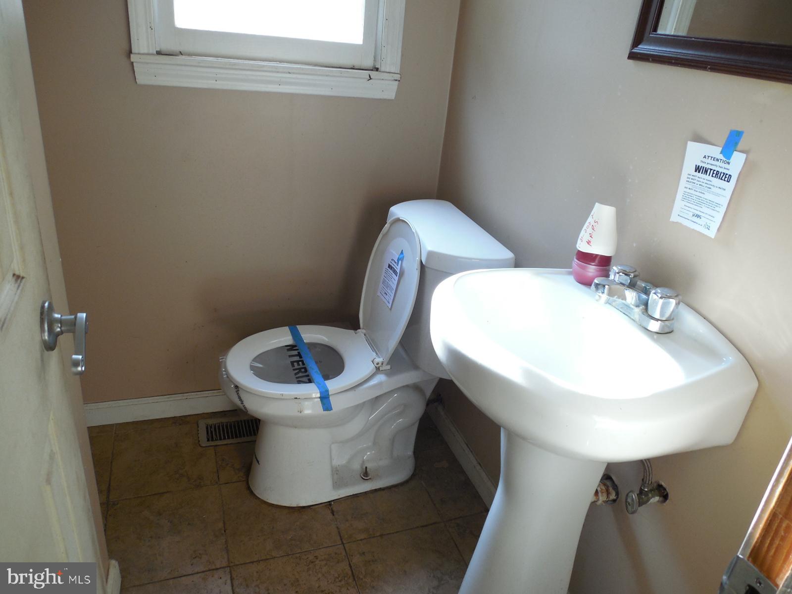27 Allegretto Road New Castle, DE 19720 - Photo 19 of 23 a bathroom with a toilet sink and mirror