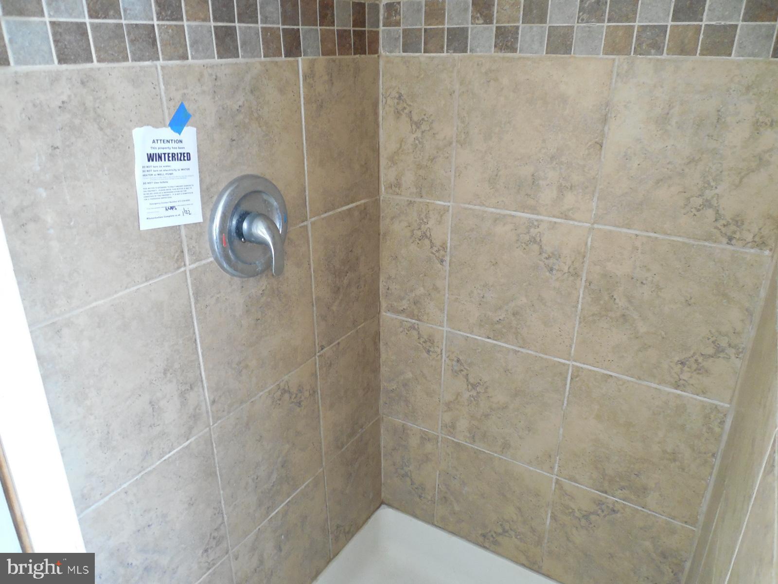 27 Allegretto Road New Castle, DE 19720 - Photo 20 of 23 a bathroom with a shower