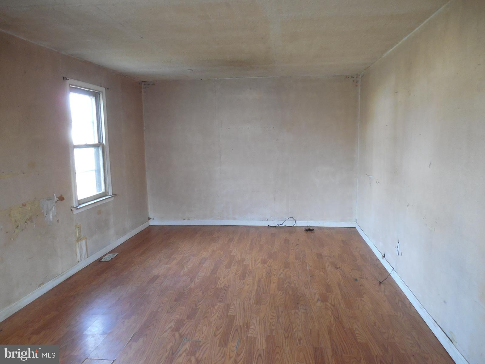 27 Allegretto Road New Castle, DE 19720 - Photo 9 of 23 an empty room with wooden floor and windows