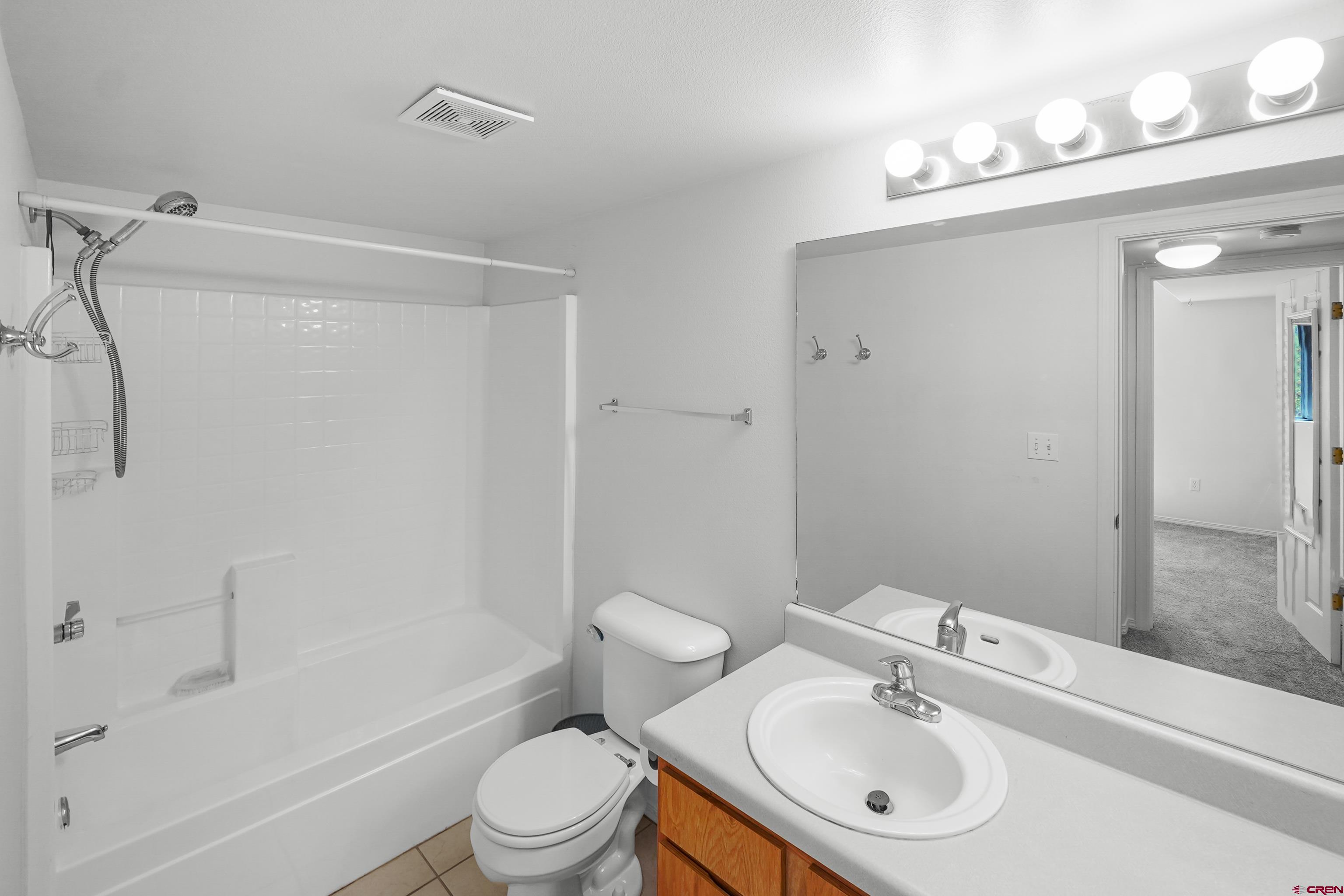 1100 Goeglein Gulch Road, Unit 163 Durango, CO 81301 - Photo 17 of 23 a bathroom with a sink toilet and shower
